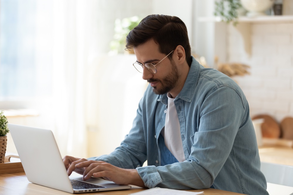 man searching information online for job